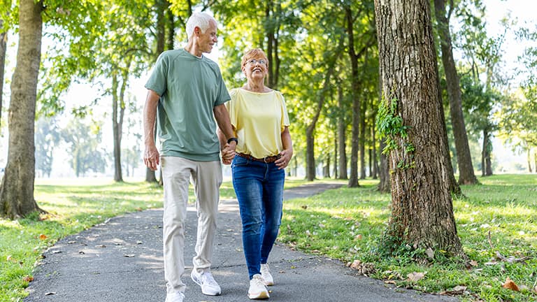 A woman walks down a trail with her husband.