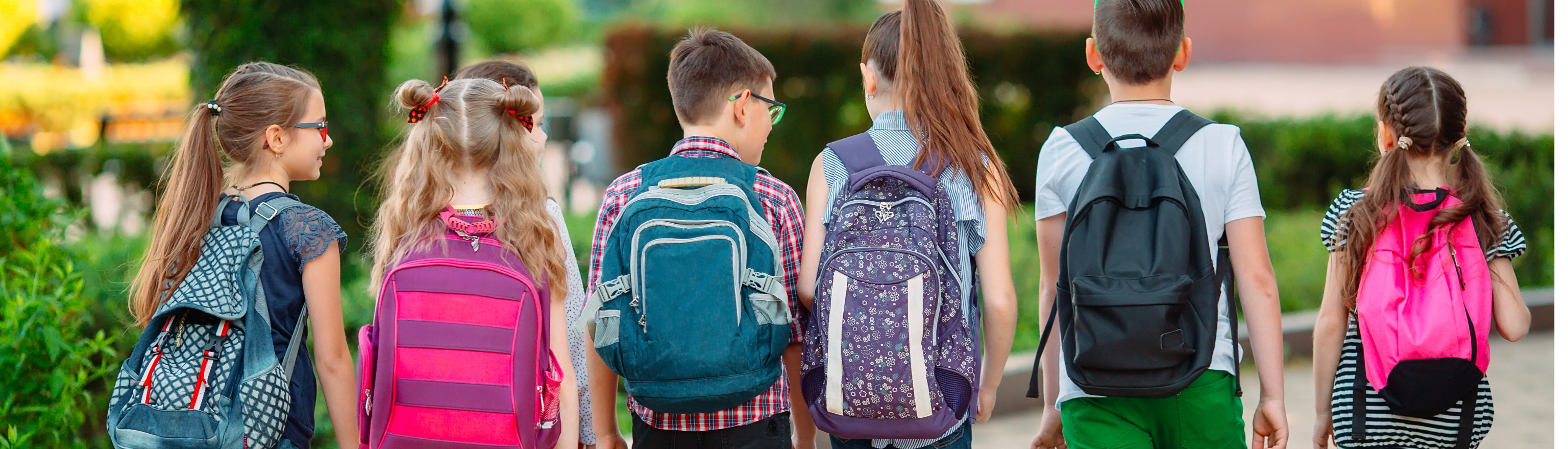 group of kids with backpacks