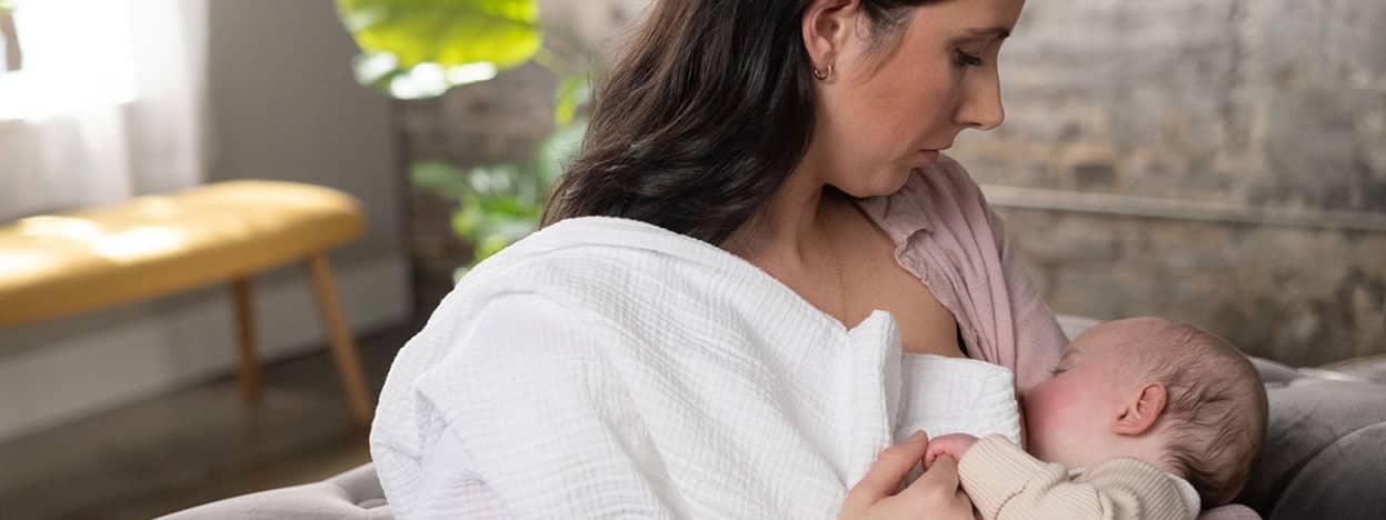 Woman nursing newborn