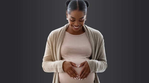 Pregnant woman hands on Belly