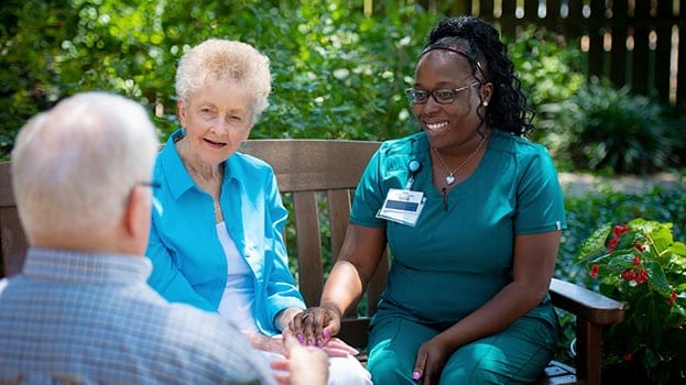 Nurse speaking with seniors