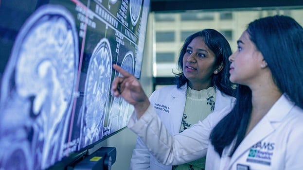 Two doctors looking at an imaging result