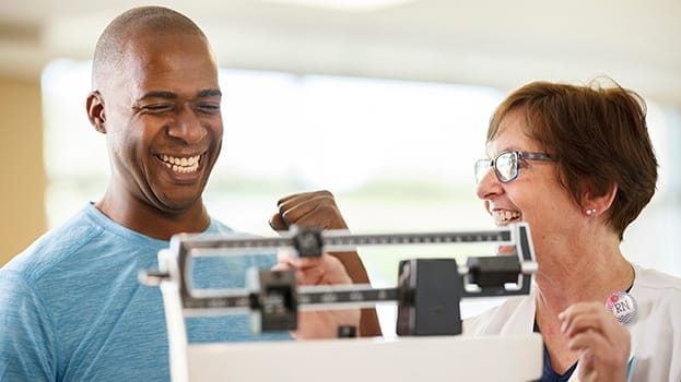 Man standing on weight scale